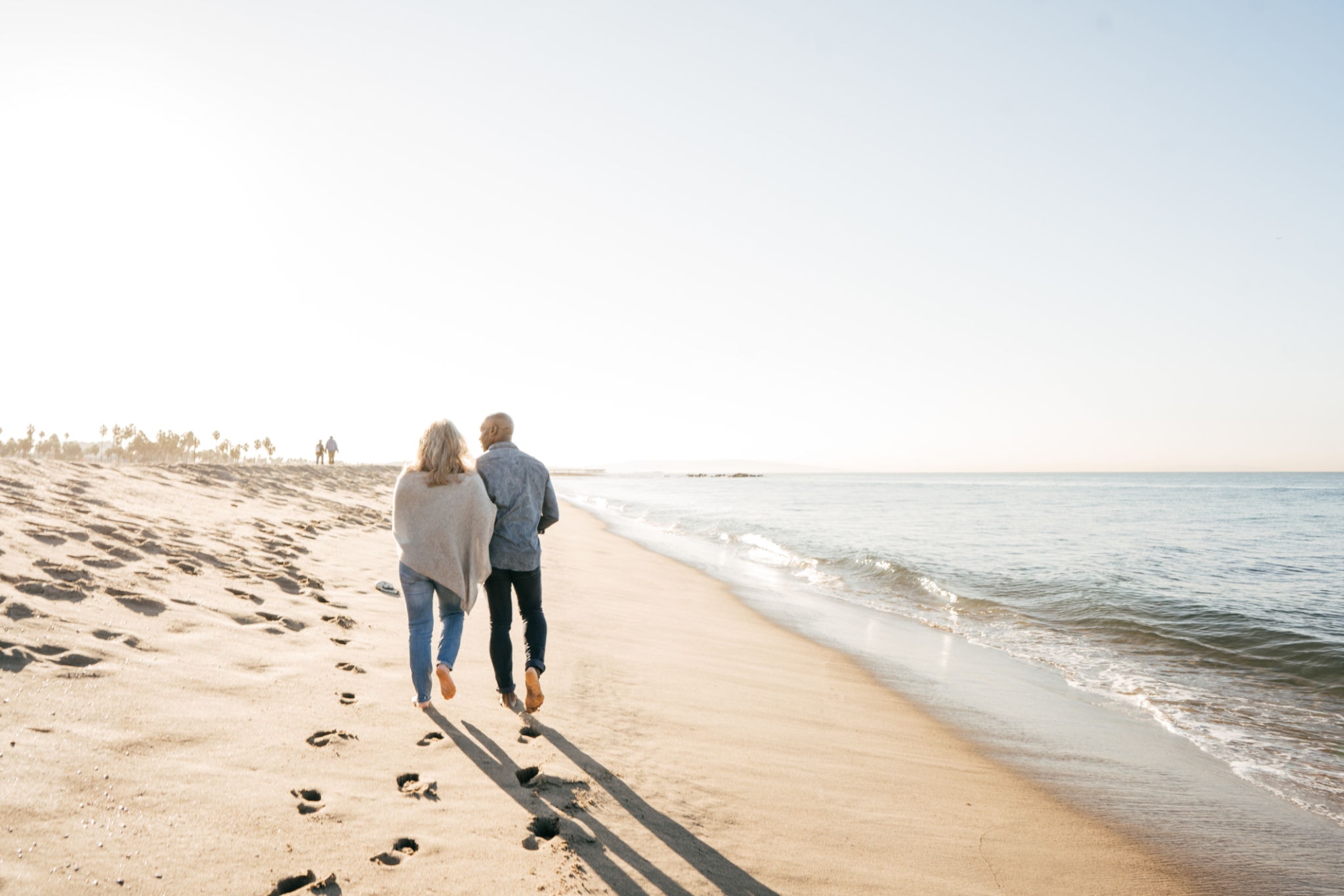 Estate planning — couple walking on beach